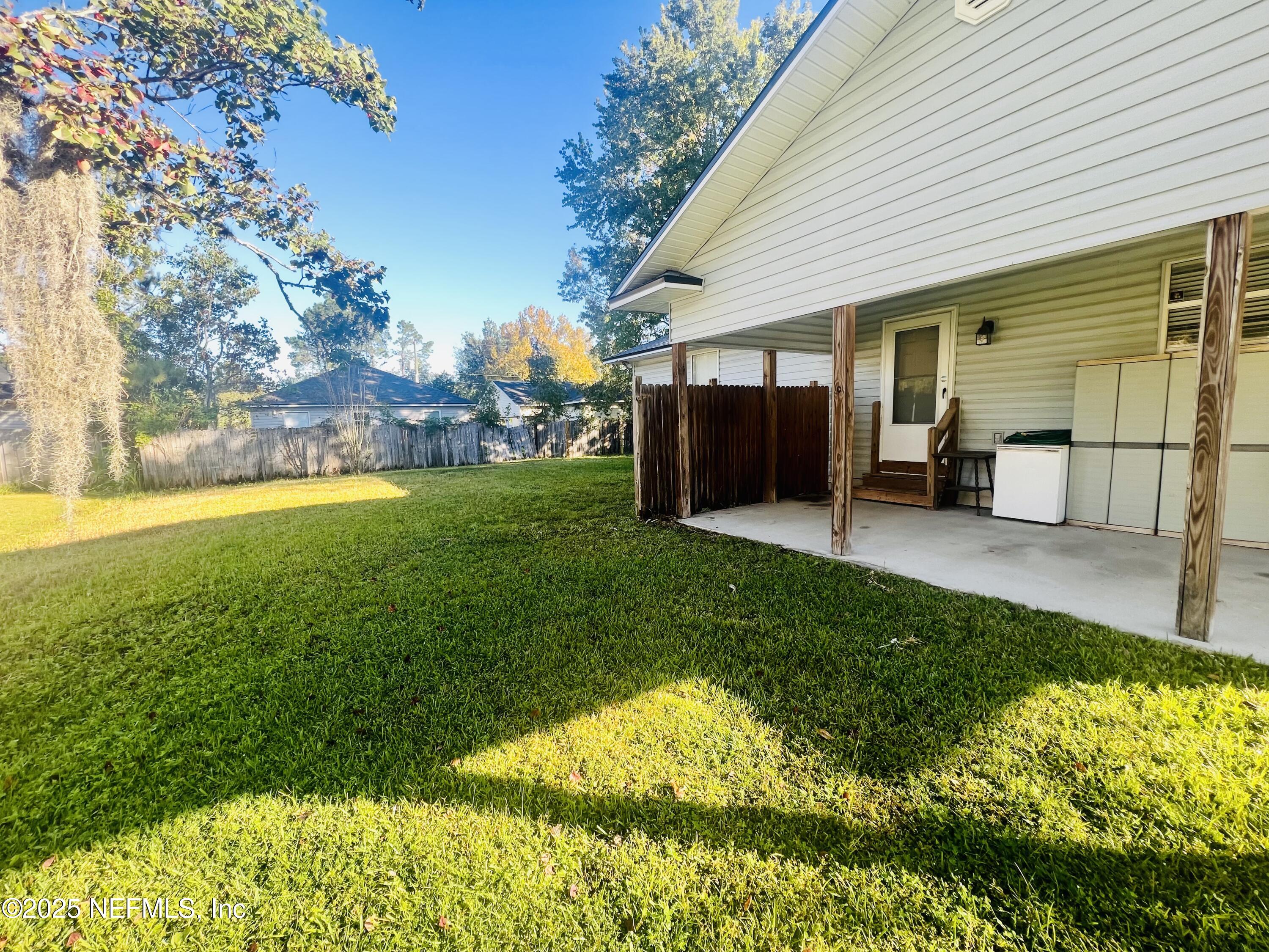 1508 Center Street Green Cove Springs, FL 32043 - Photo 22 of 24 a view of a house with backyard porch and sitting area