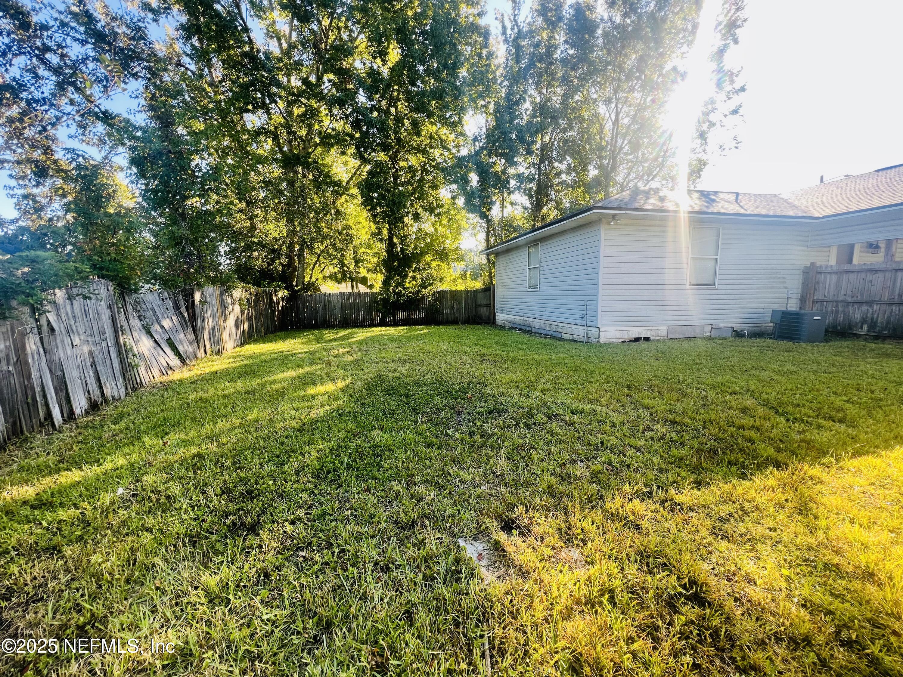 1508 Center Street Green Cove Springs, FL 32043 - Photo 24 of 24 a view of a backyard with large trees