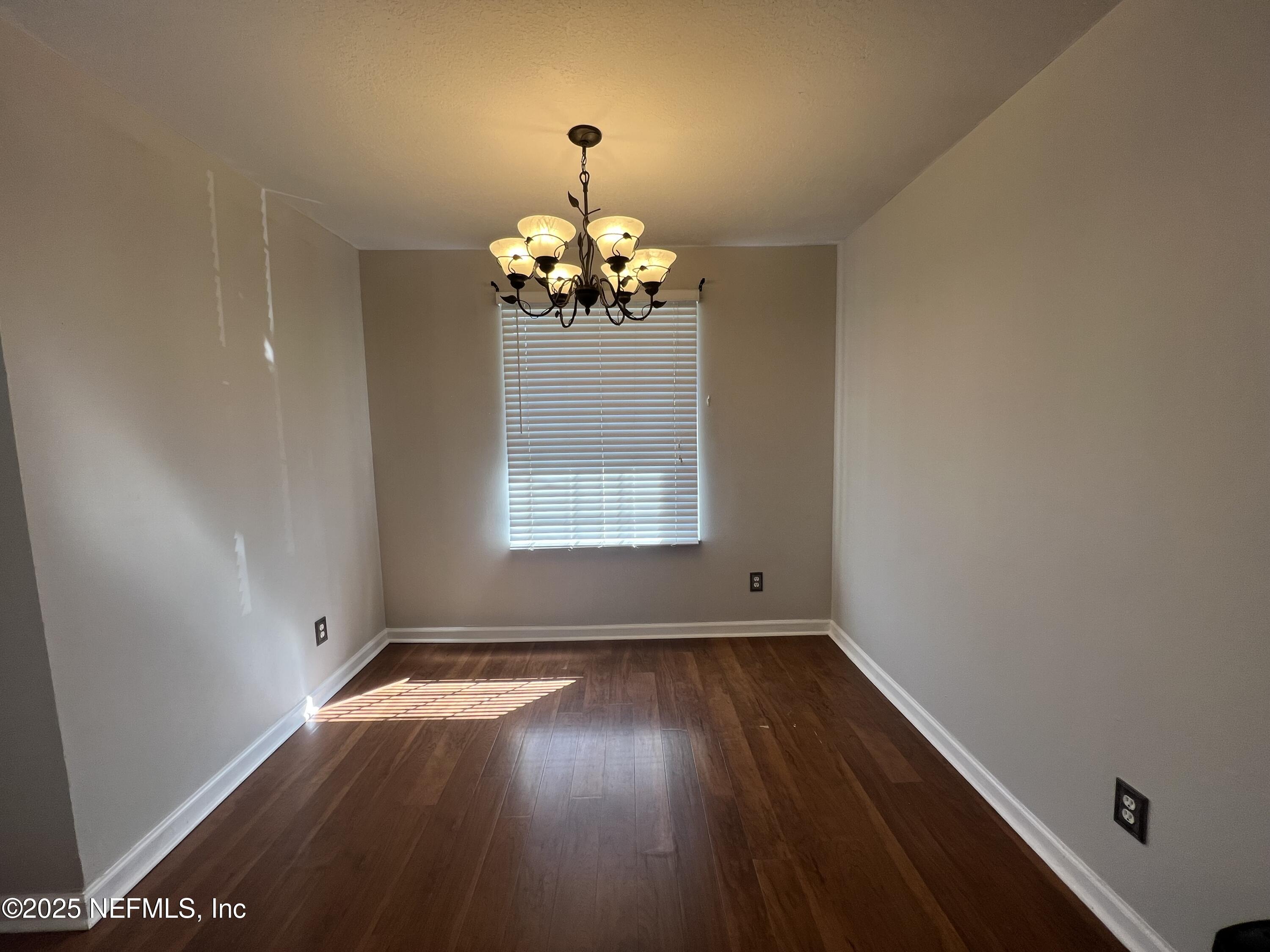 1508 Center Street Green Cove Springs, FL 32043 - Photo 8 of 24 wooden floor in an empty room with a window