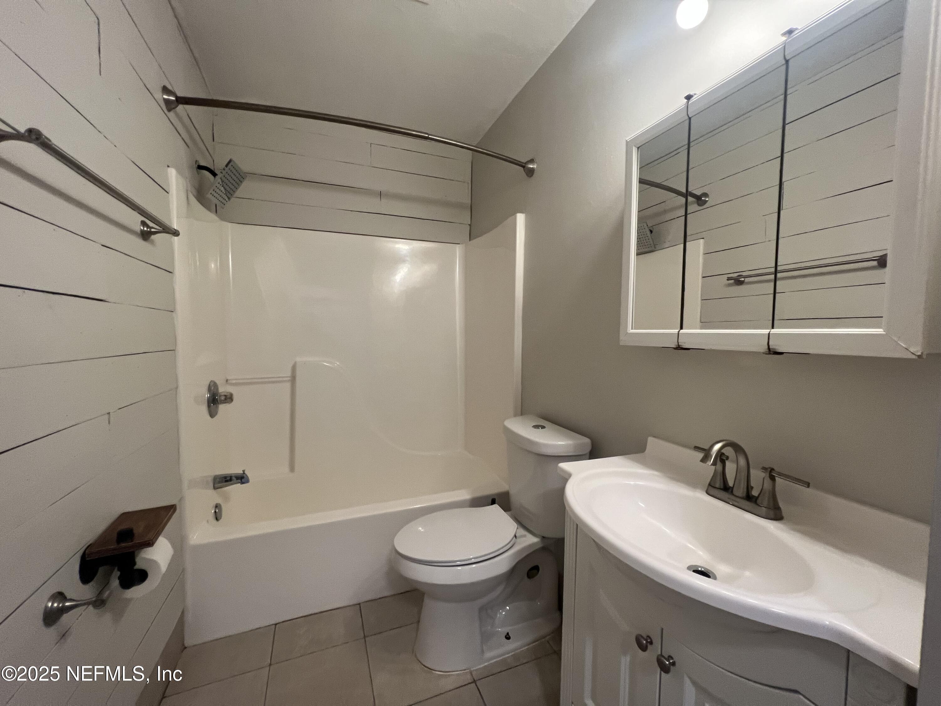 1508 Center Street Green Cove Springs, FL 32043 - Photo 9 of 24 a bathroom with a sink toilet and shower
