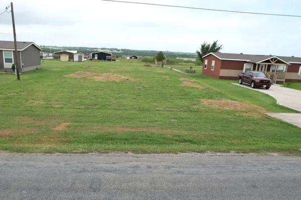 a aerial view of a house with a big yard