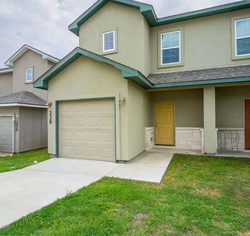 a view of a backyard of the house