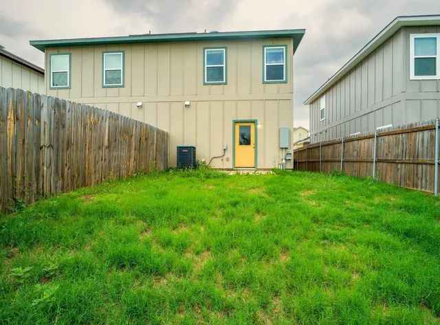 a view of backyard with a garden and stairs