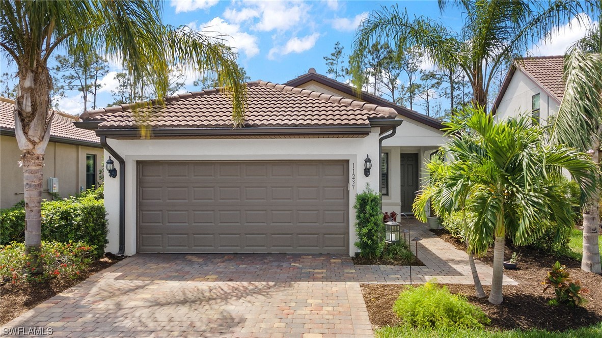 a view of house with a tree