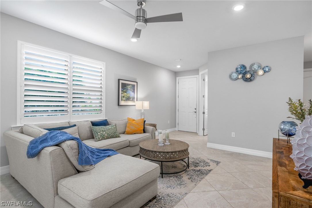 11237 Carlingford Road Fort Myers, FL 33913 - Photo 13 of 38 a living room with furniture and a large window