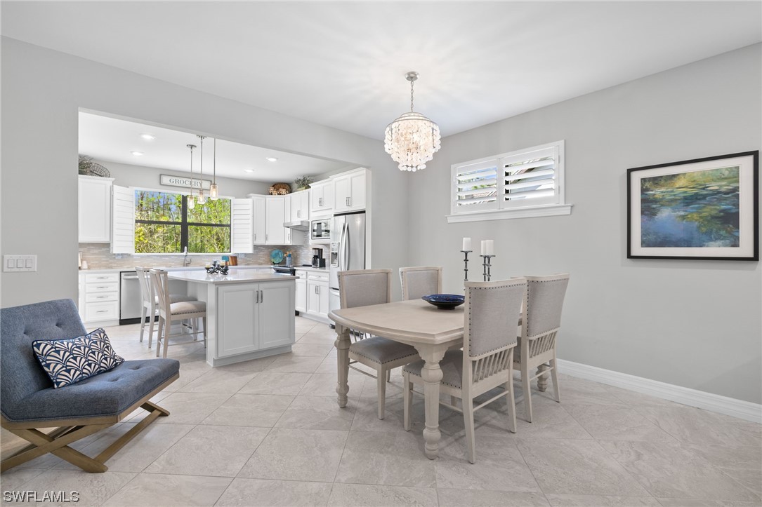 11237 Carlingford Road Fort Myers, FL 33913 - Photo 16 of 38 a view of a dining room with furniture and window
