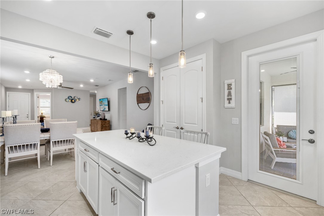 11237 Carlingford Road Fort Myers, FL 33913 - Photo 17 of 38 a view of a kitchen counter space dining table and chairs