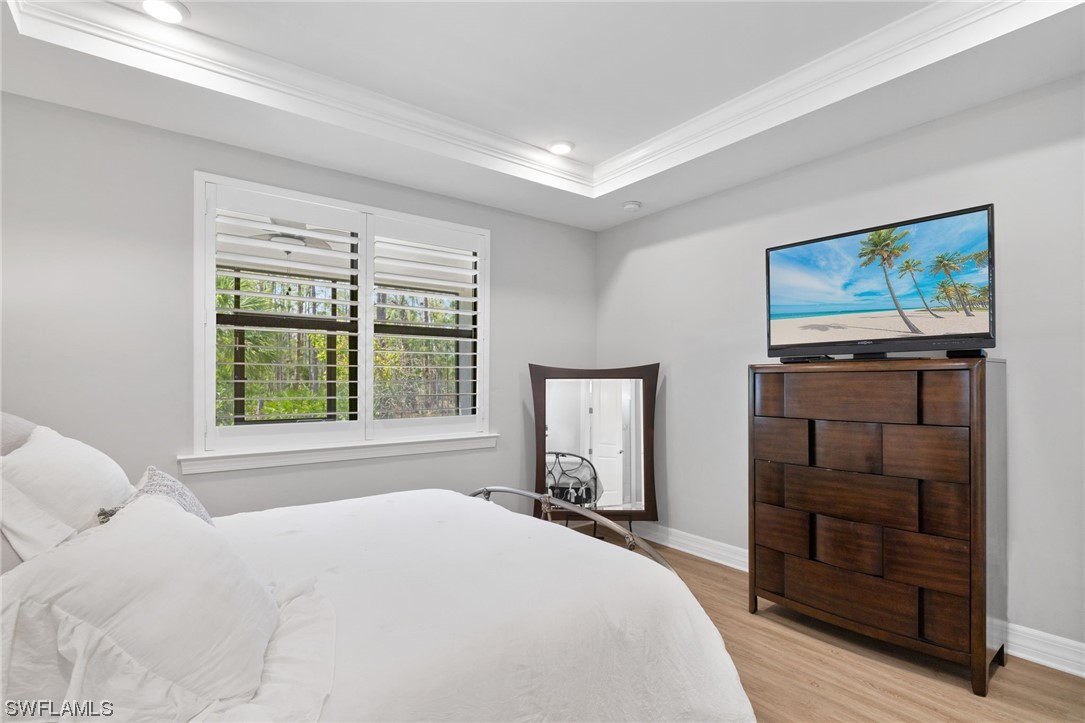 11237 Carlingford Road Fort Myers, FL 33913 - Photo 20 of 38 a bedroom with a bed and a television