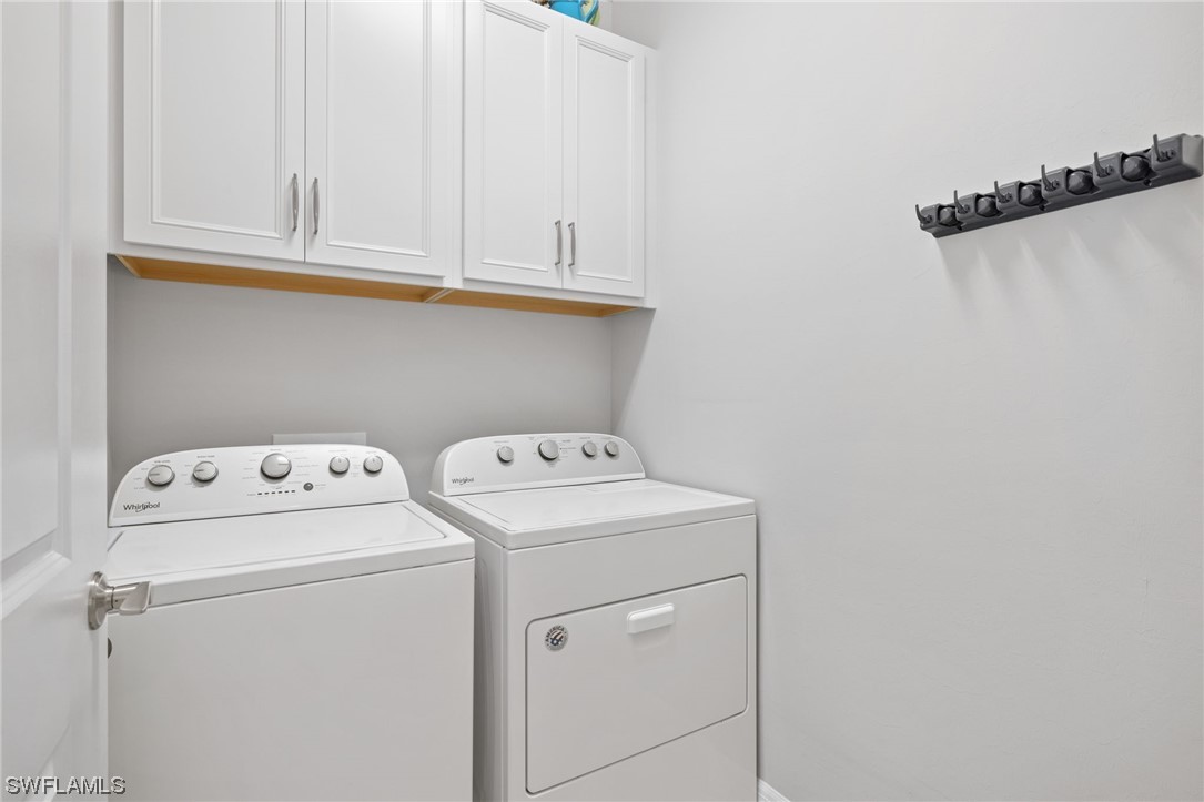 11237 Carlingford Road Fort Myers, FL 33913 - Photo 22 of 38 a utility room with dryer and washer