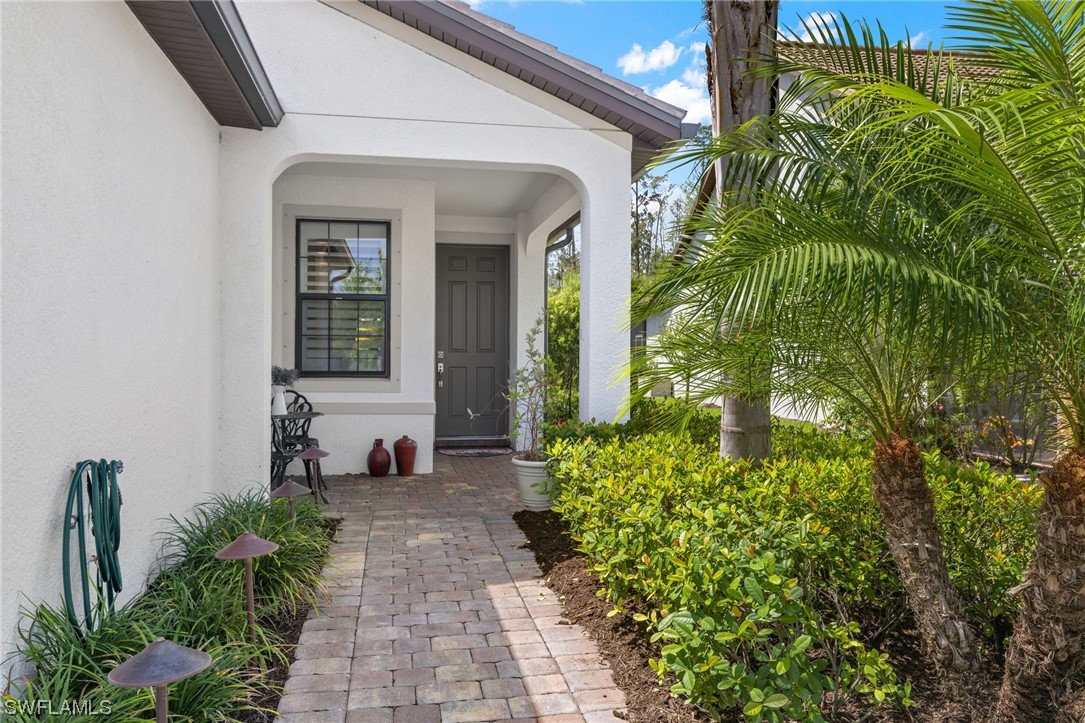 11237 Carlingford Road Fort Myers, FL 33913 - Photo 24 of 38 a view of a house with potted plants