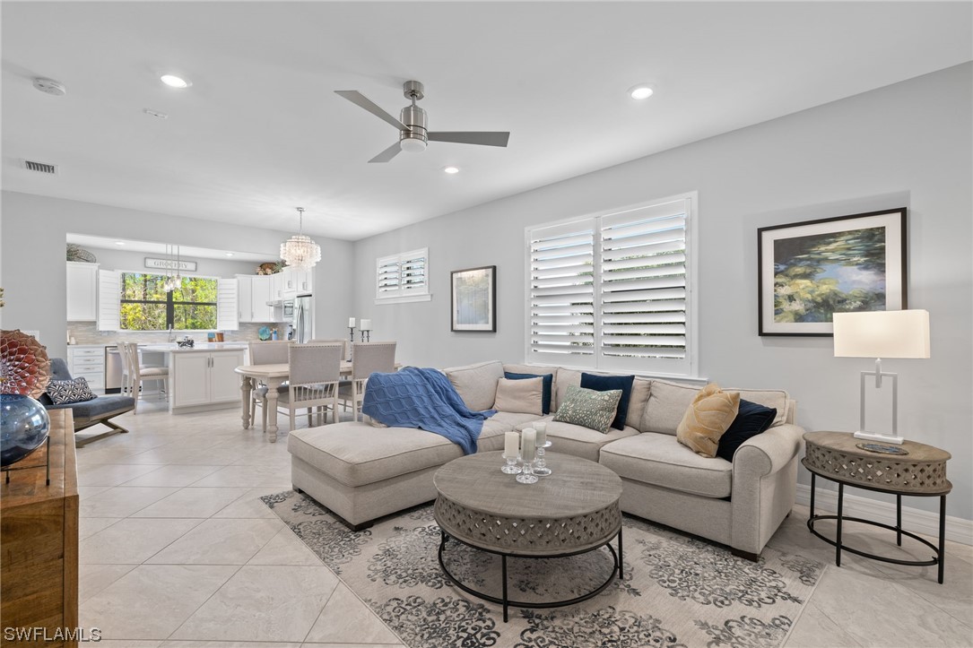 11237 Carlingford Road Fort Myers, FL 33913 - Photo 4 of 38 a living room with furniture and a large window