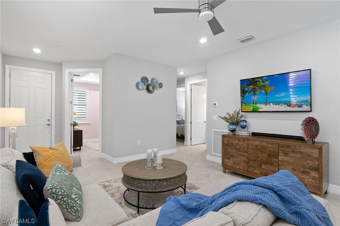11237 Carlingford Road Fort Myers, FL 33913 - Photo 5 of 38 a living room with furniture and a flat screen tv
