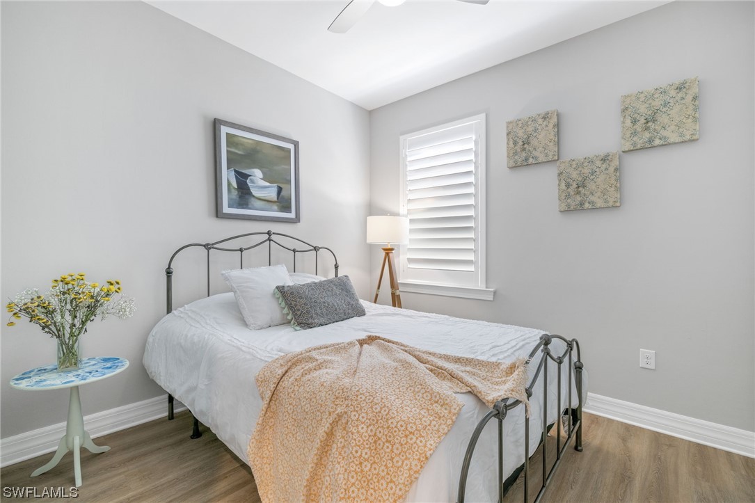 11237 Carlingford Road Fort Myers, FL 33913 - Photo 9 of 38 a bedroom with a bed and a table