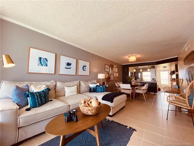 a living room with furniture and a lamp