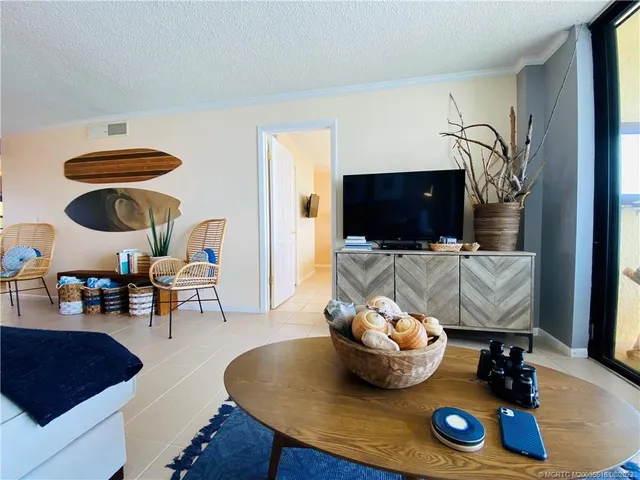 a living room with furniture rug and window