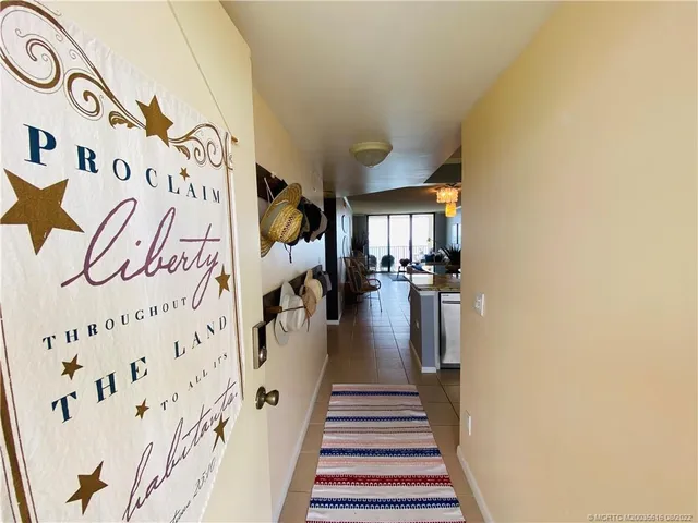 a kitchen with a stove a sink and a refrigerator