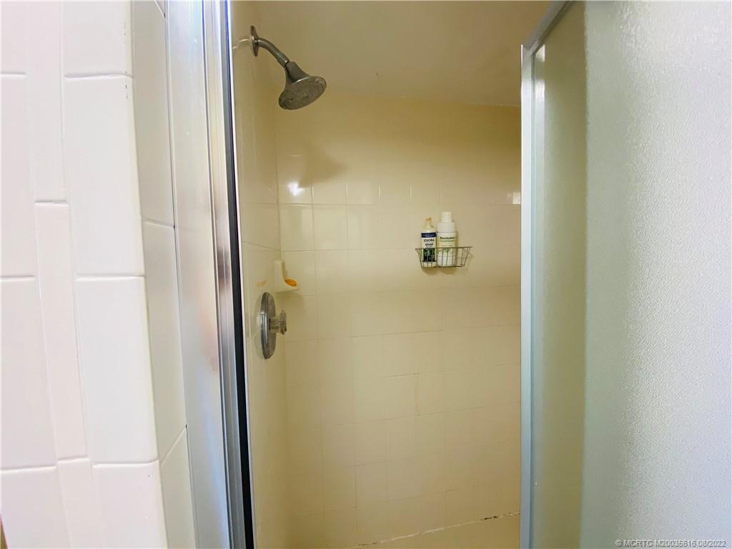 7380 South Ocean Drive, Unit 718A Jensen Beach, FL 34957 - Photo 38 of 58 a bathroom with a shower