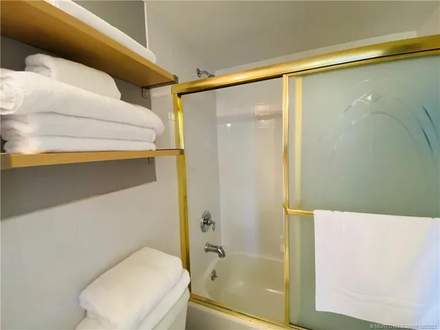 a view of house with swimming pool outdoor seating