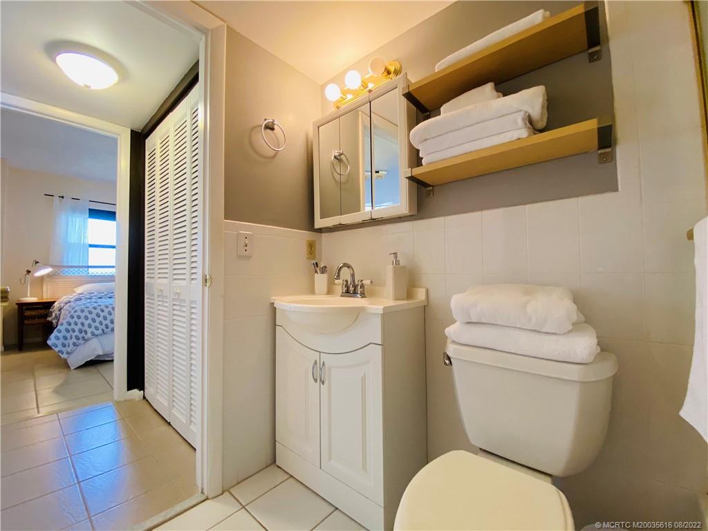 7380 South Ocean Drive, Unit 718A Jensen Beach, FL 34957 - Photo 48 of 58 a bathroom with a sink toilet and shower