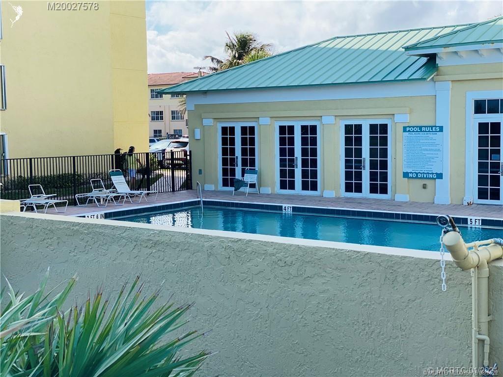 7380 South Ocean Drive, Unit 718A Jensen Beach, FL 34957 - Photo 53 of 58 a view of swimming pool with outdoor seating