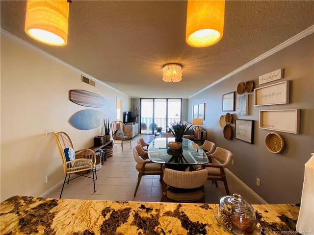 a living room with furniture a rug and a window