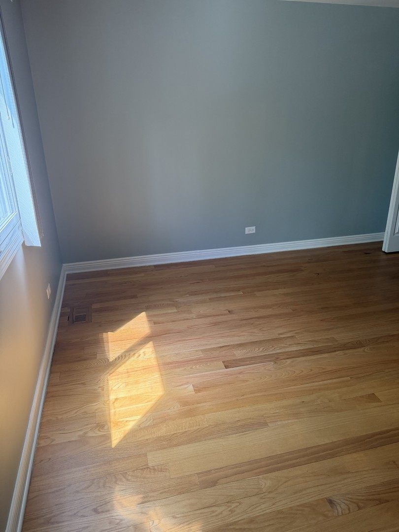 606 Bridgeport Place Wheeling, IL 60090 - Photo 20 of 25 a view of empty room with wooden floor