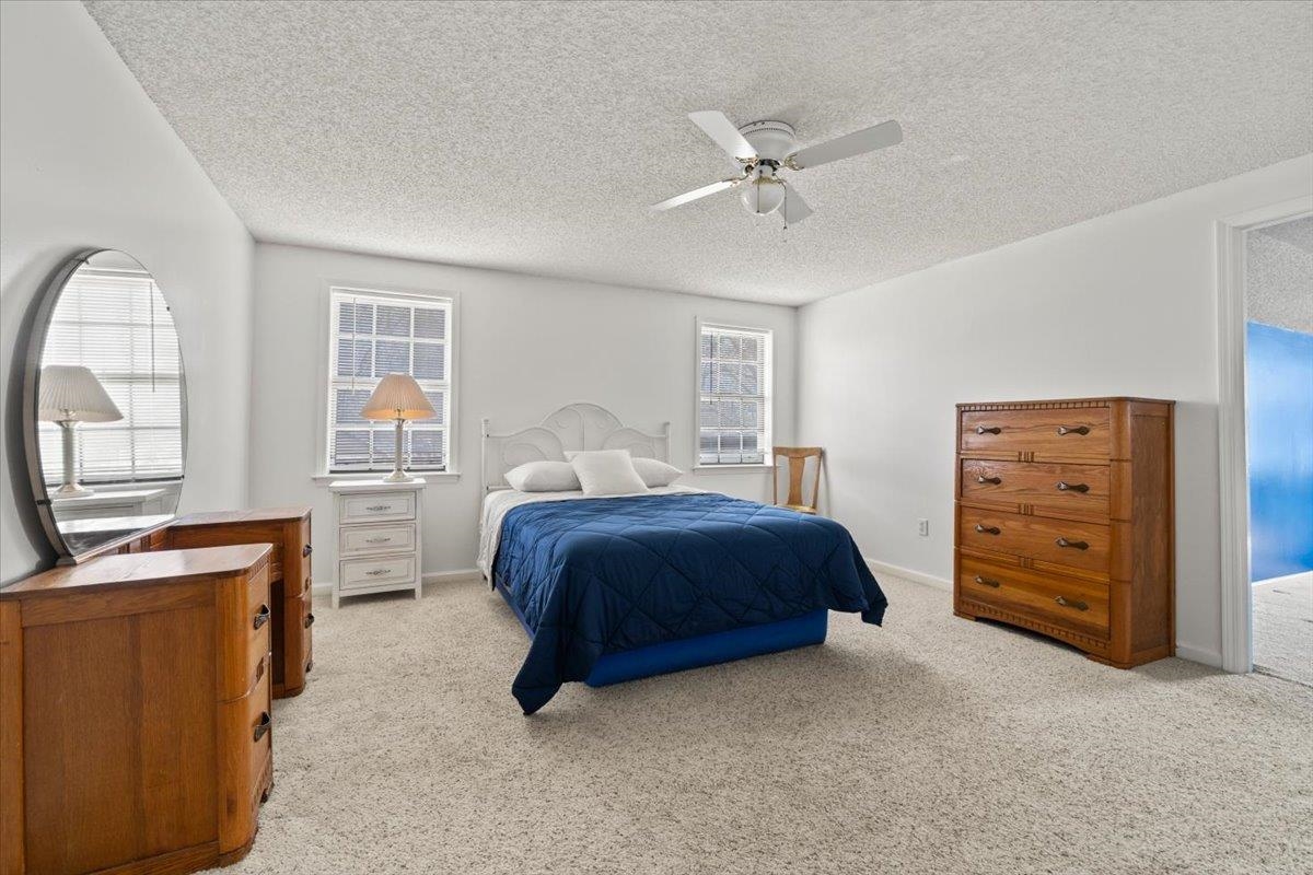676 Hermitage Trail Collierville, TN 38017 - Photo 13 of 15 a spacious bedroom with a bed and a dresser