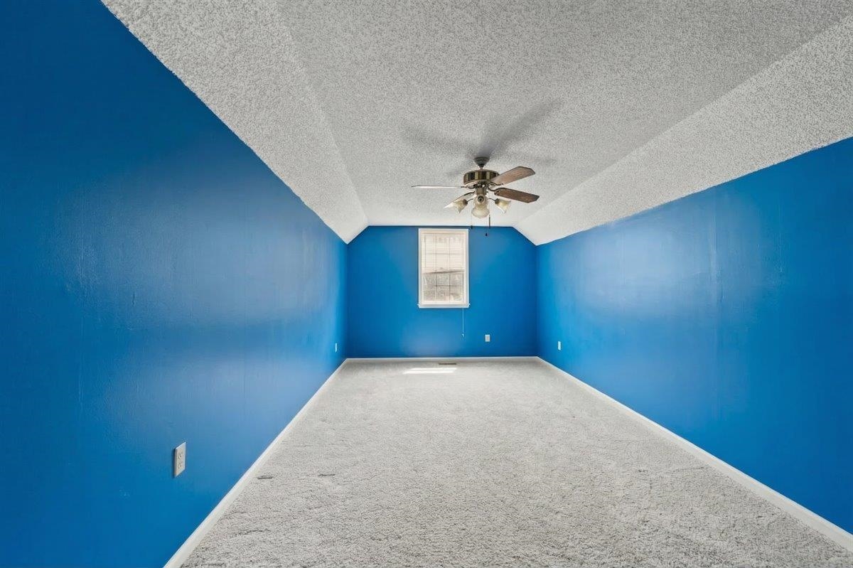 676 Hermitage Trail Collierville, TN 38017 - Photo 14 of 15 a view of a room with a ceiling fan and window