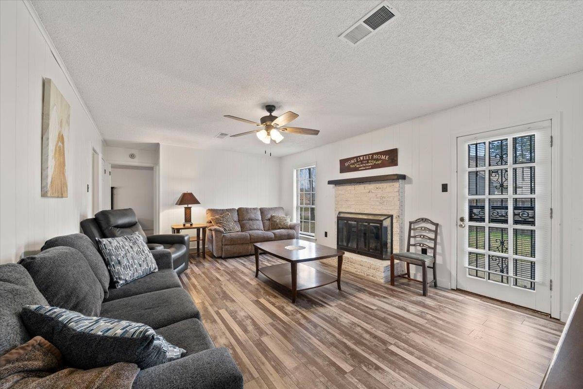 676 Hermitage Trail Collierville, TN 38017 - Photo 4 of 15 a living room with furniture a fireplace and a flat screen tv