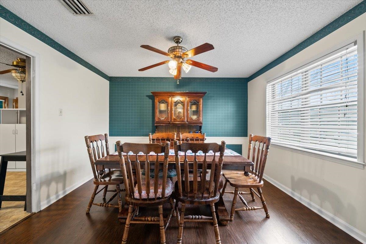 676 Hermitage Trail Collierville, TN 38017 - Photo 6 of 15 a view of a dining room with furniture window and wooden floor