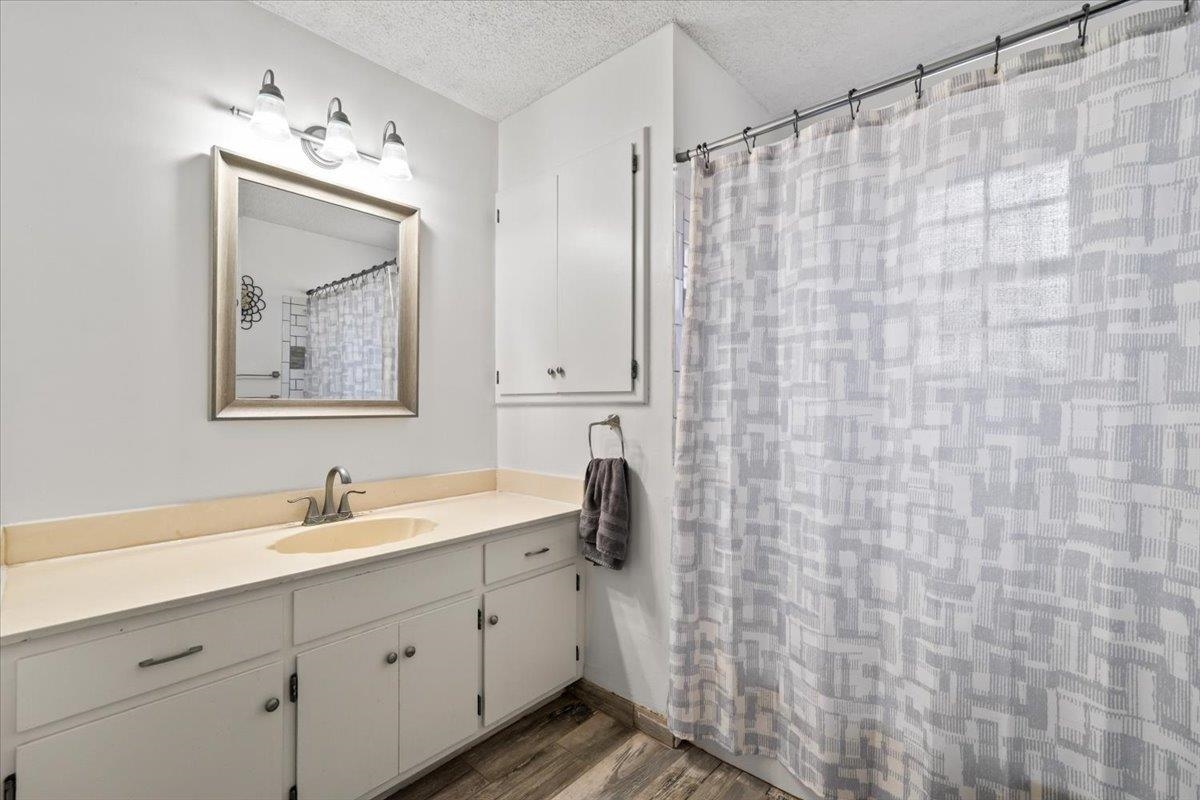676 Hermitage Trail Collierville, TN 38017 - Photo 9 of 15 a bathroom with a sink a vanity and a mirror