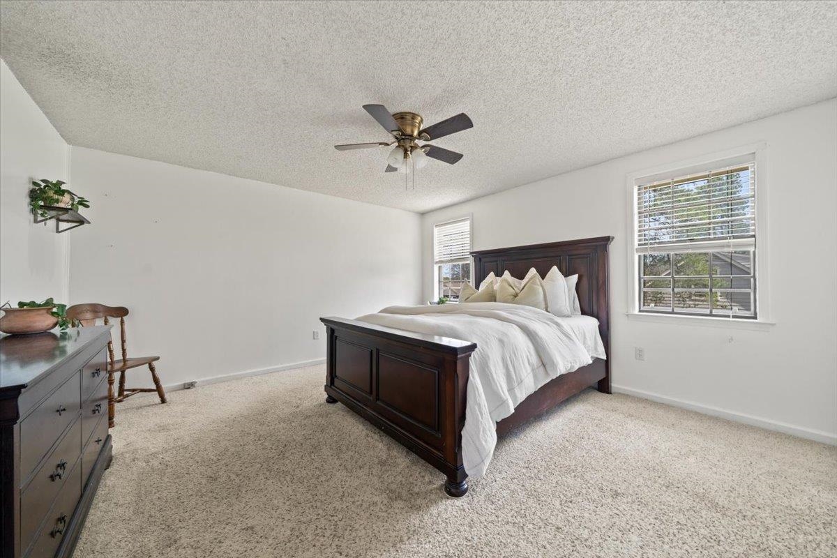 676 Hermitage Trail Collierville, TN 38017 - Photo 10 of 15 a bed sitting in a bedroom next to a window