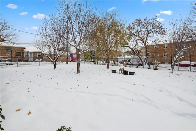 a tree in the garden of a building