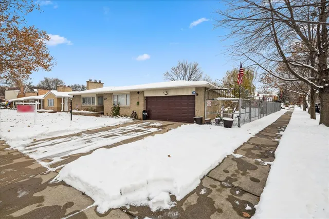 a view of a house with snow on the road