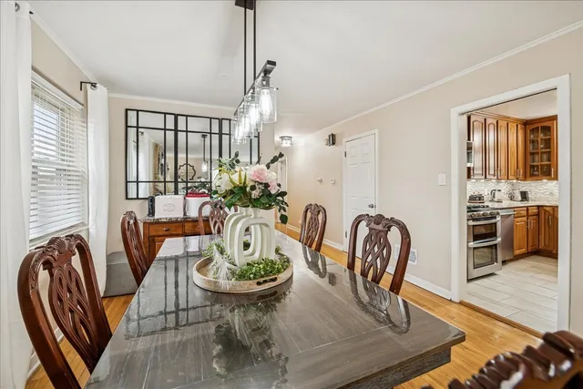 a view of a dining room with furniture window and wooden floor