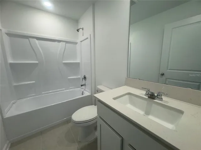 a bathroom with a sink a toilet and a bathtub