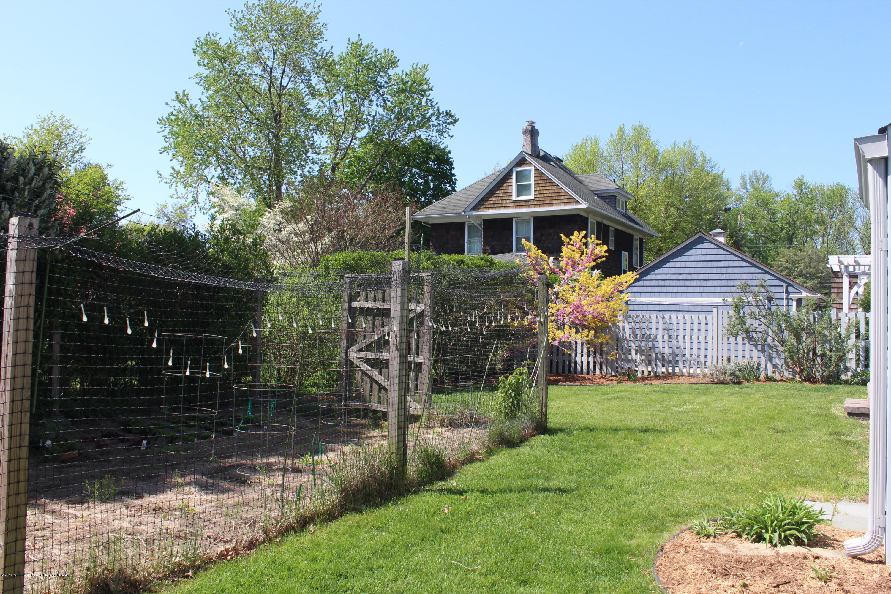 12 Little Silver Point Road Little Silver, NJ 07739 - Photo 25 of 29 a front view of a house with a yard