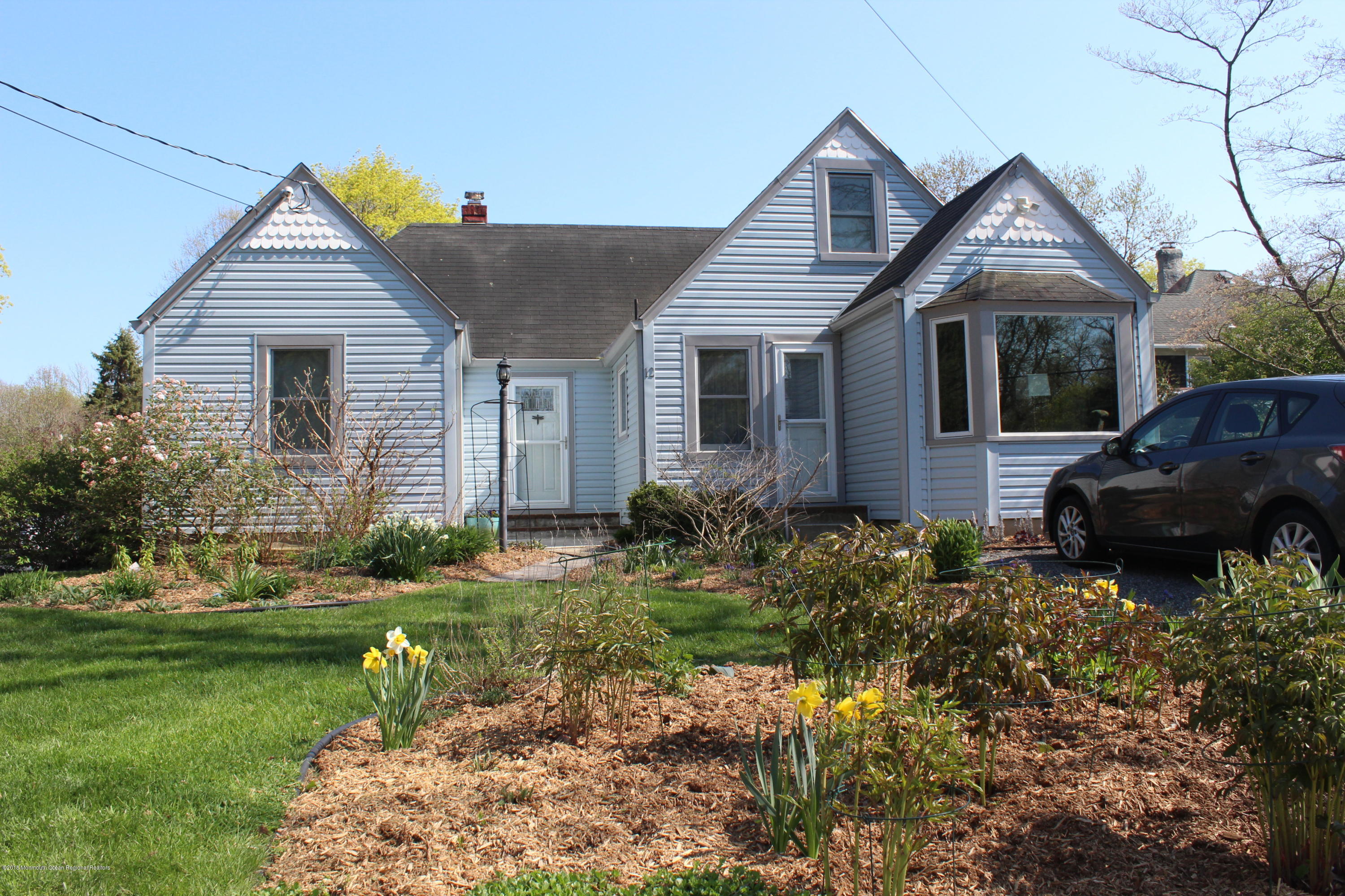 12 Little Silver Point Road Little Silver, NJ 07739 - Photo 28 of 29 a front view of house with a garden
