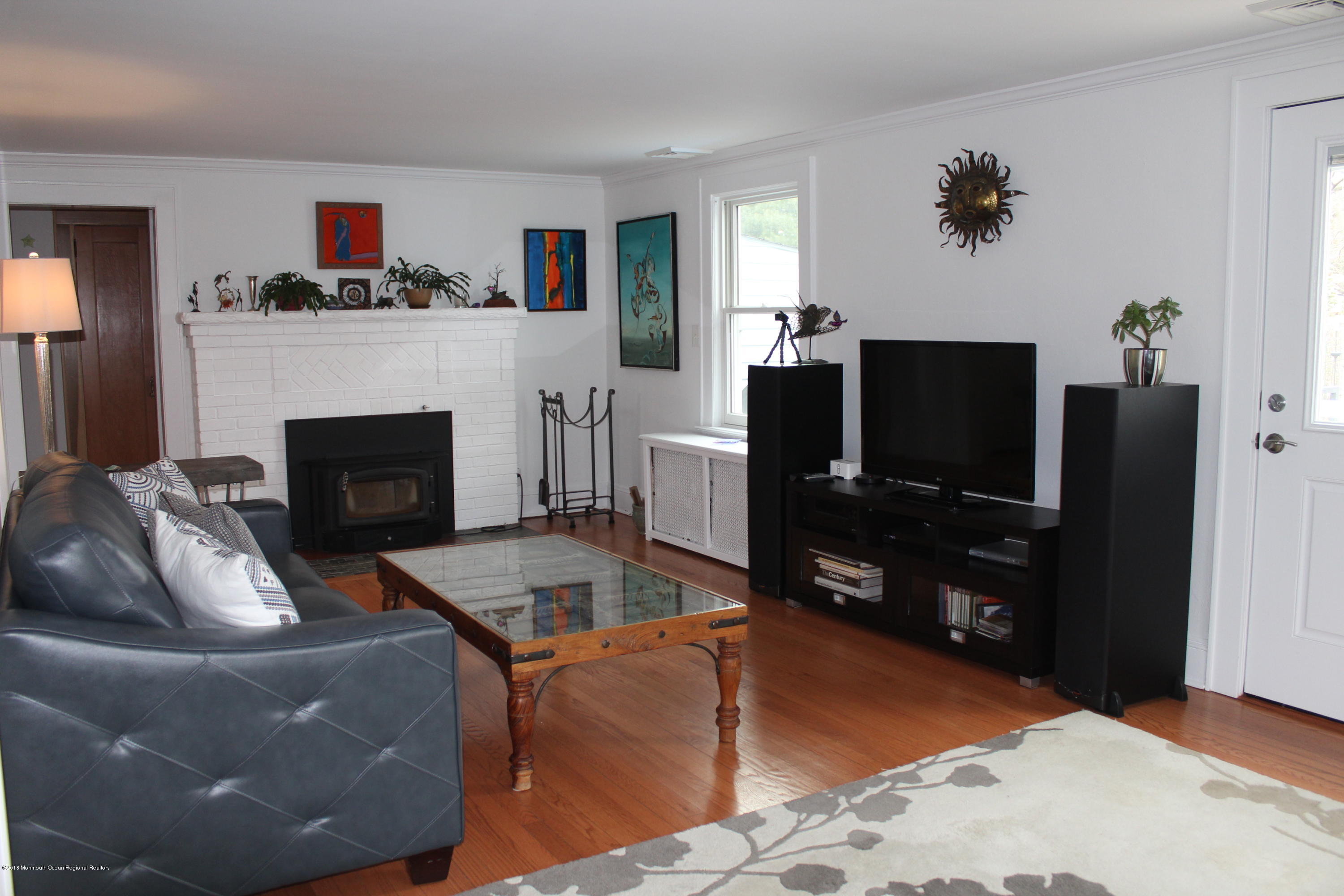 12 Little Silver Point Road Little Silver, NJ 07739 - Photo 3 of 29 a living room with furniture and a flat screen tv