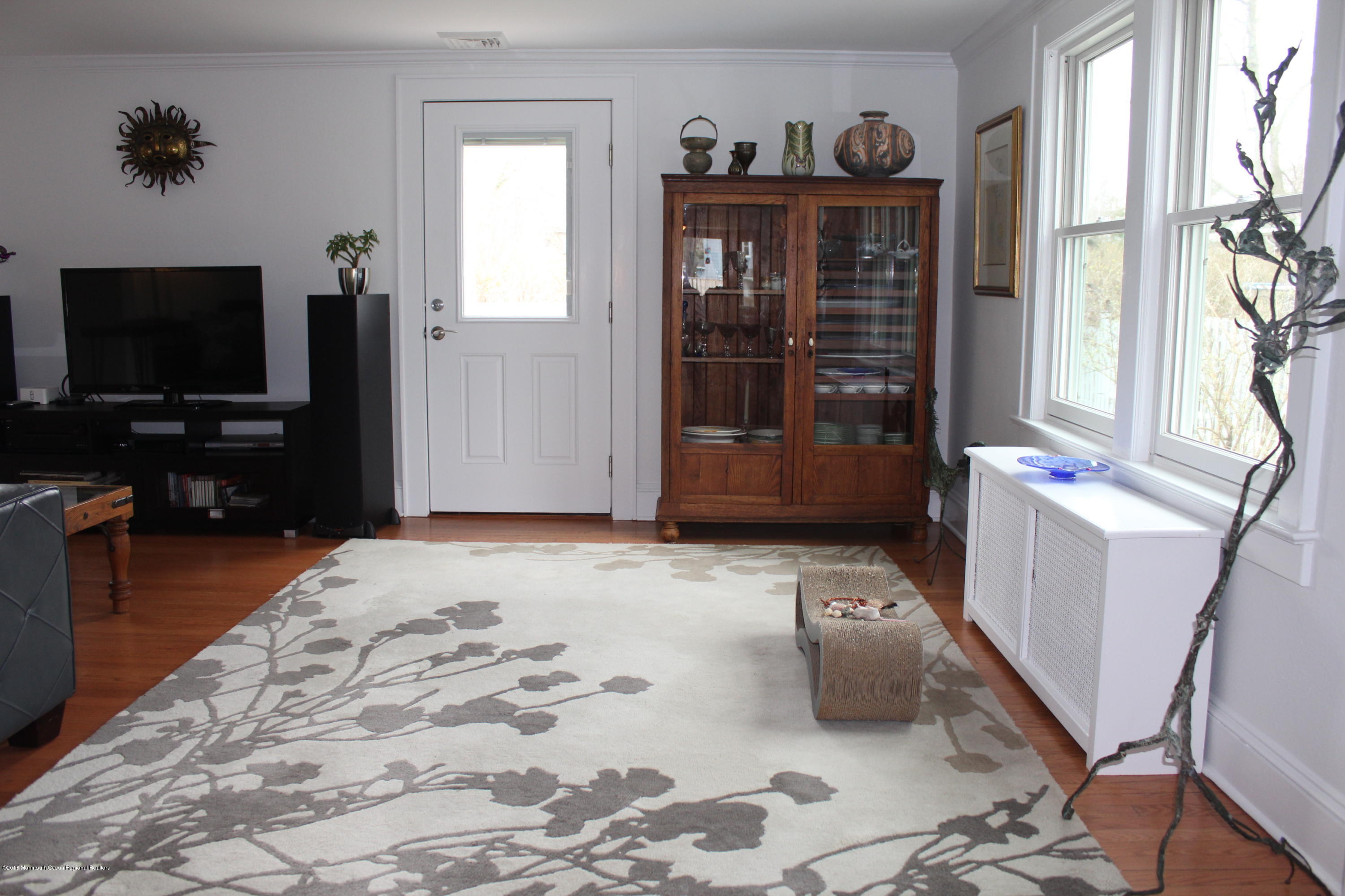 12 Little Silver Point Road Little Silver, NJ 07739 - Photo 5 of 29 a living room with furniture and a flat screen tv