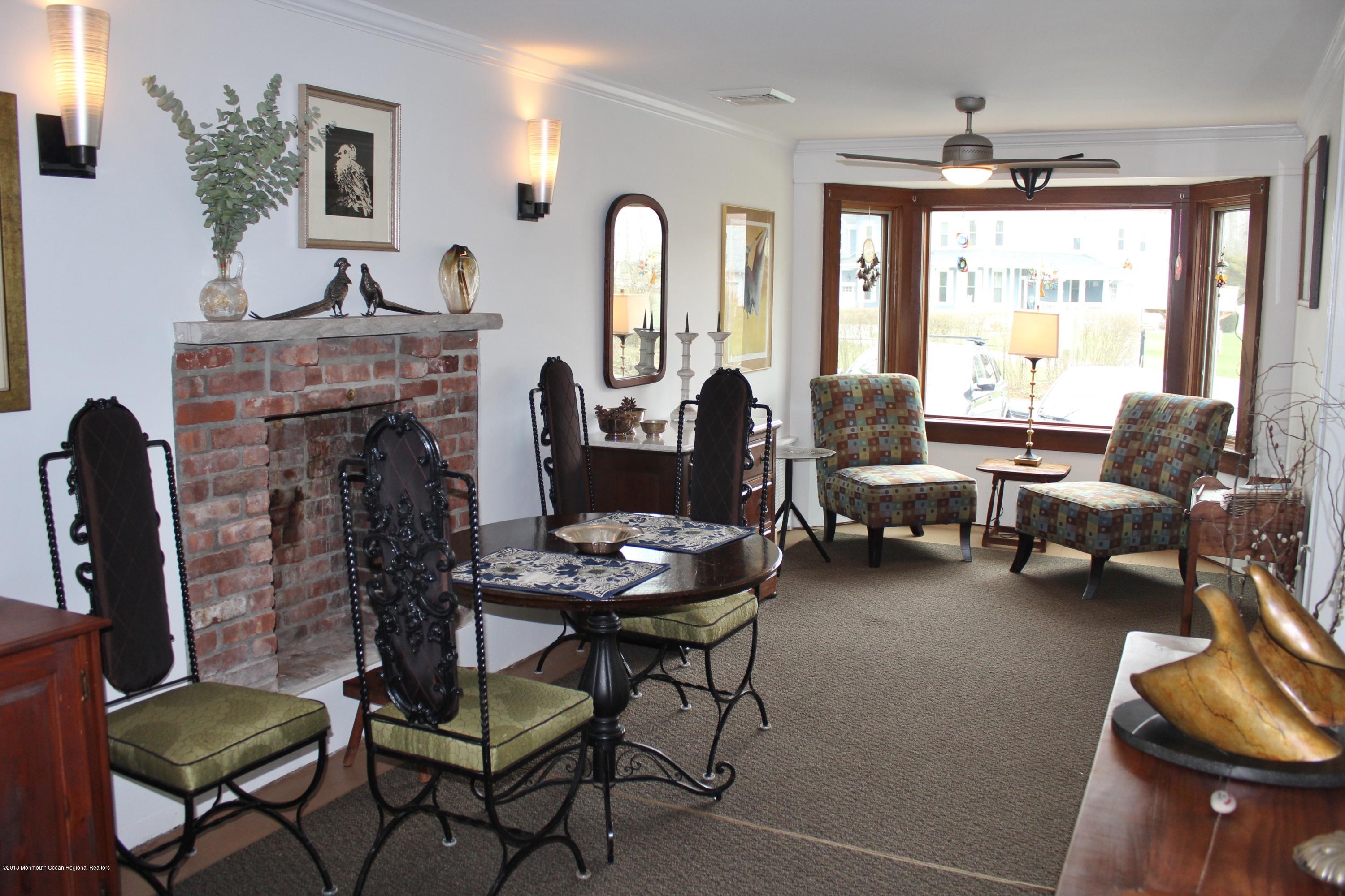 12 Little Silver Point Road Little Silver, NJ 07739 - Photo 6 of 29 a living room with furniture and a fireplace