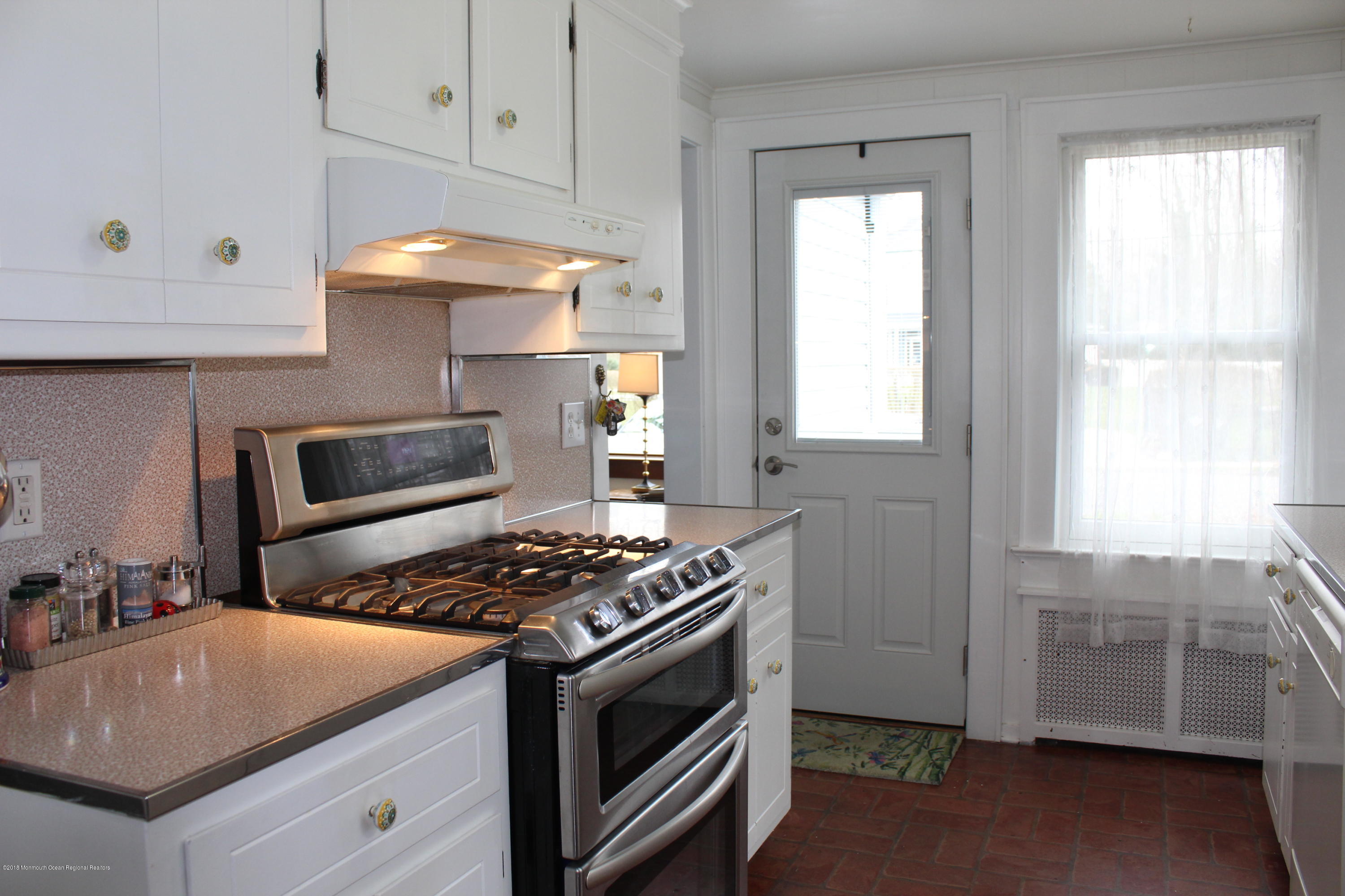 12 Little Silver Point Road Little Silver, NJ 07739 - Photo 9 of 29 a kitchen with granite countertop a stove and a sink