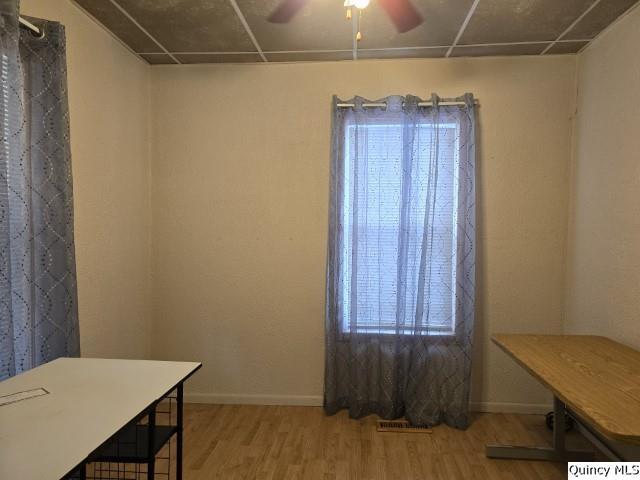 729 Buchanan Street Carthage, IL 62321 - Photo 4 of 16 a view of a room with a wooden table and chair