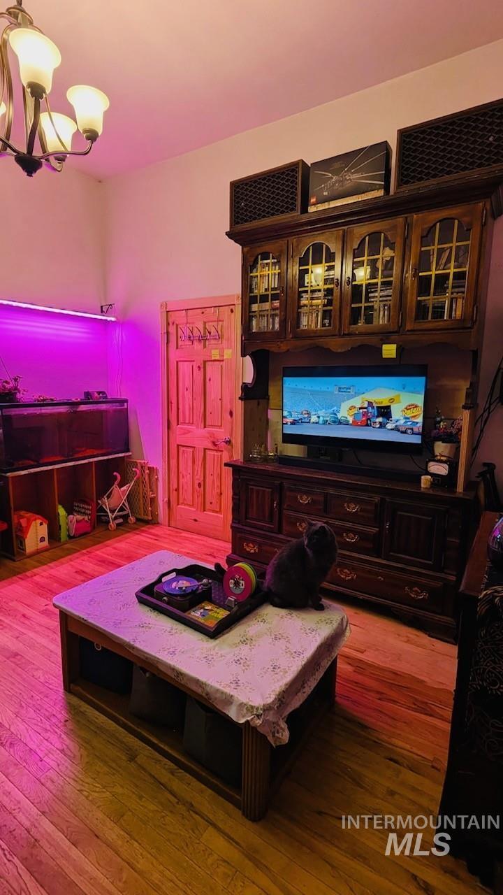 411 South Pine Street Troy, ID 83871 - Photo 4 of 10 Living room with light wood-style flooring and suspended lighting