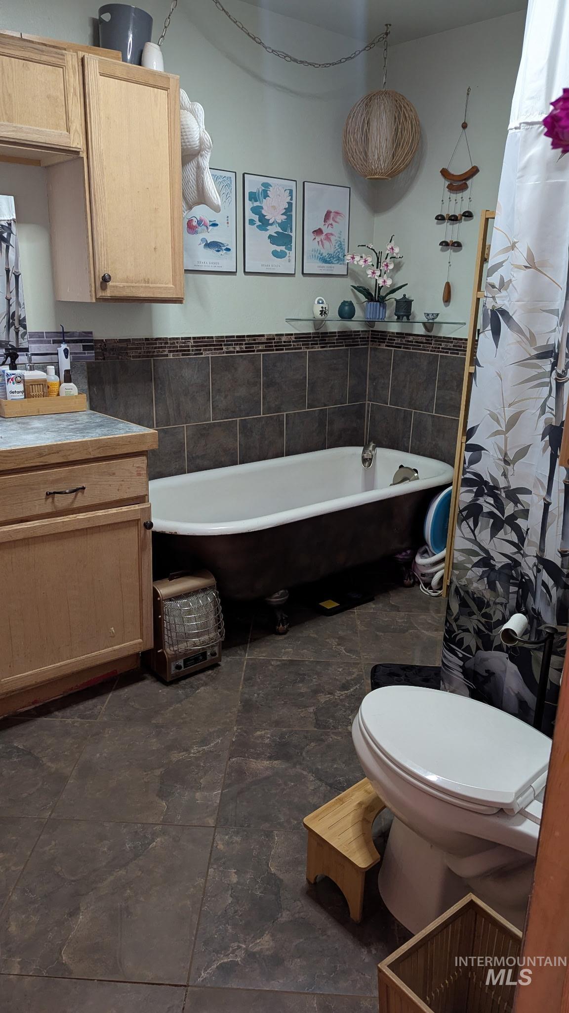 411 South Pine Street Troy, ID 83871 - Photo 10 of 10 Full bath featuring a freestanding tub, vanity, and tile walls