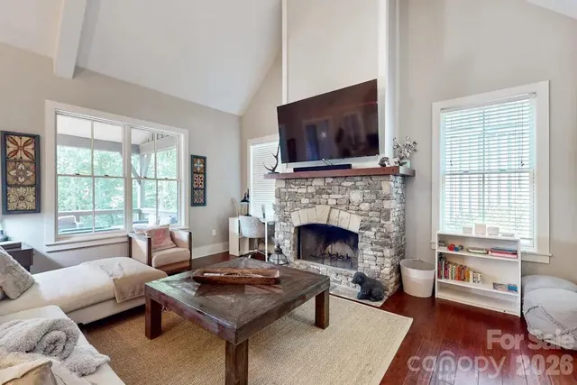 a living room with furniture and a fireplace