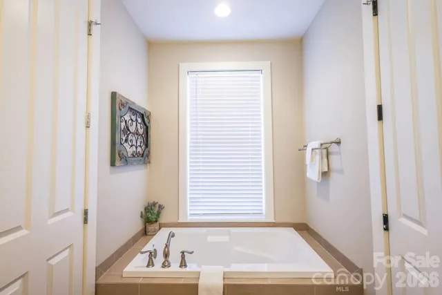 a bathroom with a bathtub and shower