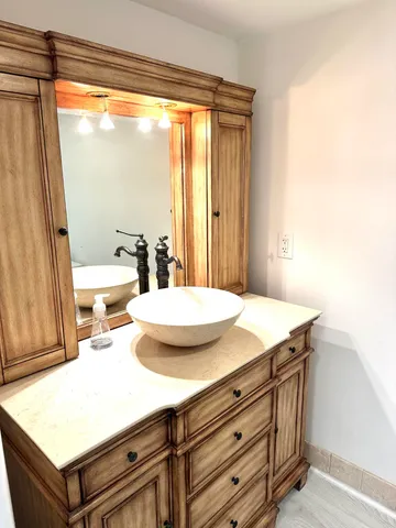 a room with a table chairs and wooden floor