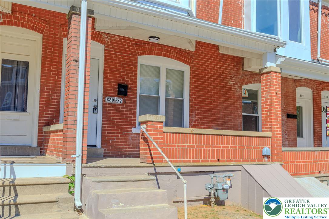 820 North 5th Street Allentown, PA 18102 - Photo 3 of 39 A classic brick facade with inviting front steps, offering a timeless street presence.