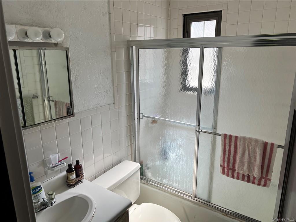 202 Garden Road Larchmont, NY 10538 - Photo 14 of 19 a bathroom with a sink toilet and shower